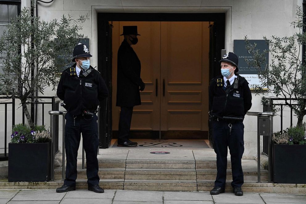 PHOTO: Police officers stand on duty outside King Edward VII's Hospital in central London on March 15, 2021.