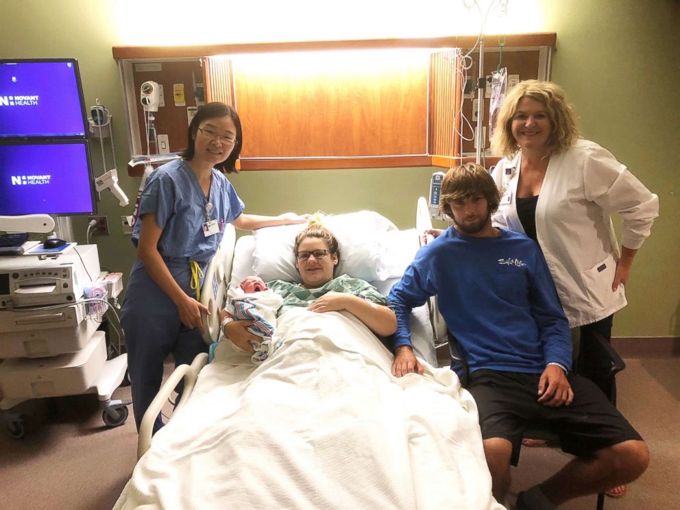 PHOTO: Proud Amber Simmons and Conner Fault of Supply, N.C., are seen with their newborn son Carson on Sept. 13 with Dr. Li Xu (left), Novant Health OB/GYN and Jill Ward, Chief Nursing Officer of Novant Health Brunswick Medical Center in Bolivia, N.C.