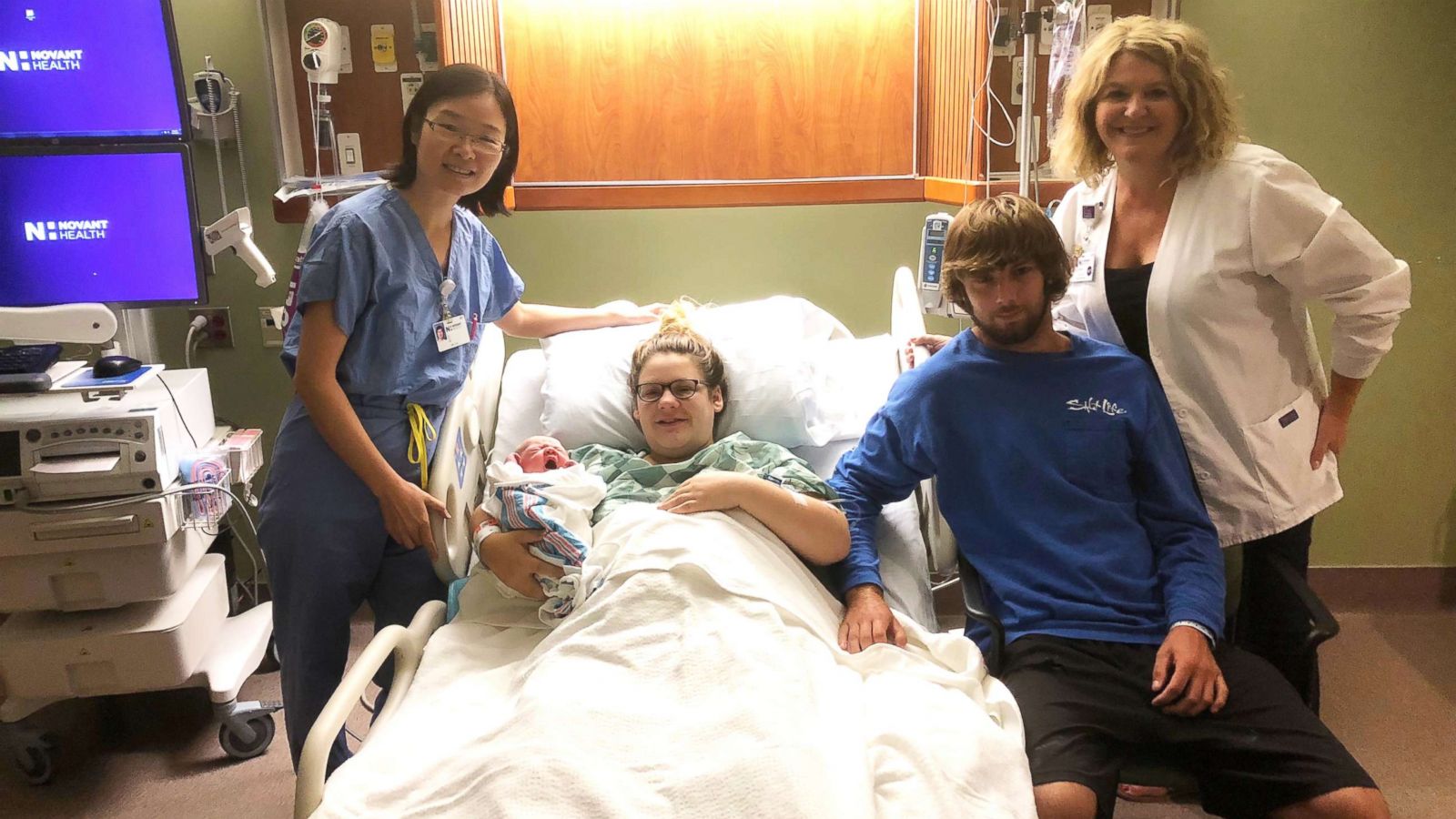 PHOTO: Amber Simmons and Conner Fault of Supply, N.C. are seen with their newborn son Carson on Sept. 13 with Dr. Li Xu (left), Novant Health OB/GYN and Jill Ward, Chief Nursing Officer of Novant Health Brunswick Medical Center in Bolivia, N.C.