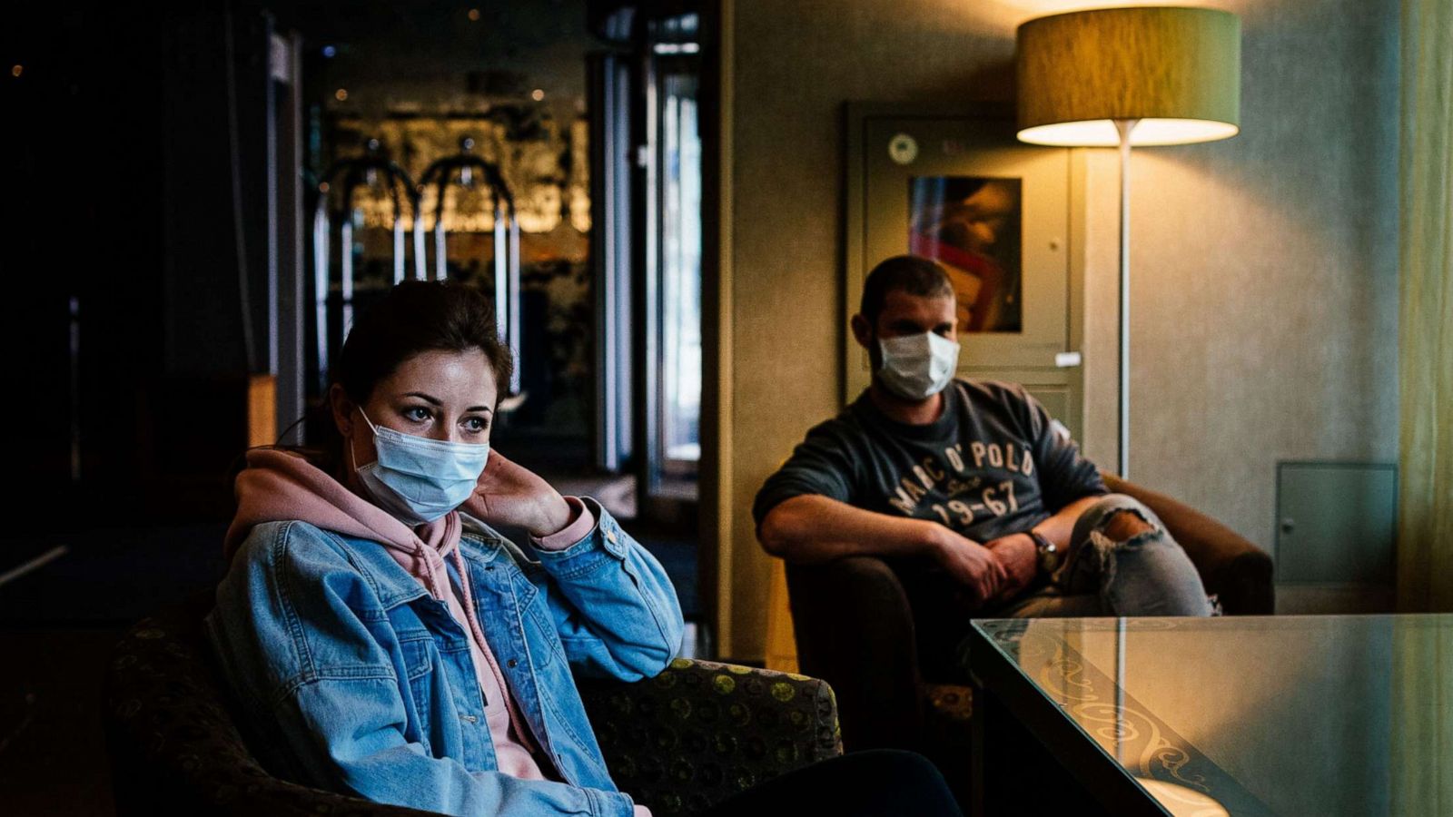 PHOTO: Anastasia Mishustina, 32, a nurse, and Alexei Manikin, 34, a medic, rest at a lobby of Holiday Inn in Moscow, April 29, 2020.