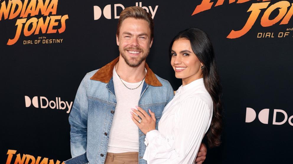 PHOTO: Derek Hough and Hayley Erbert attends the Indiana Jones and the Dial of Destiny U.S. Premiere at the Dolby Theatre in Hollywood, Calif., June 14, 2023. 