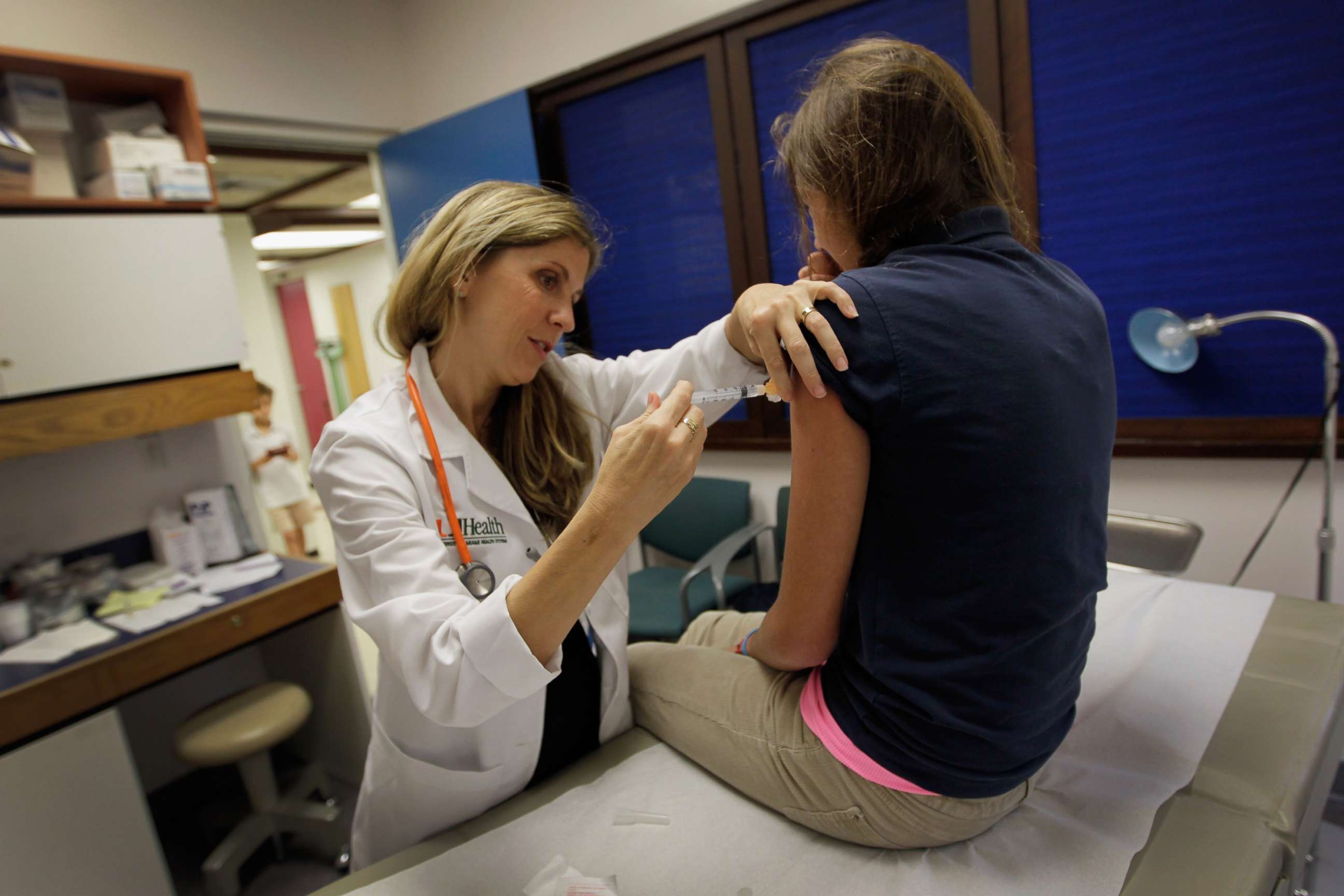 PHOTO: University of Miami pediatrician Judith L. Schaechter gives an HPV vaccination to a 13-year-old girl in her office at the Miller School of Medicine on Sept. 21, 2011, in Miami.