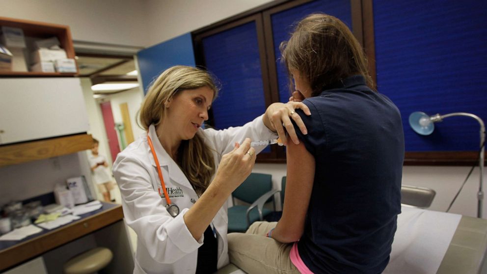 PHOTO: University of Miami pediatrician Judith L. Schaechter gives an HPV vaccination to a 13-year-old girl in her office at the Miller School of Medicine on Sept. 21, 2011, in Miami.