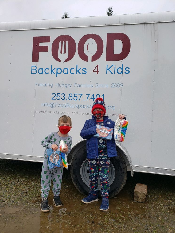 PHOTO: Duke and Hudson Galligan drop off hot cocoa and marshmallows to Food Backpacks 4 Kids.