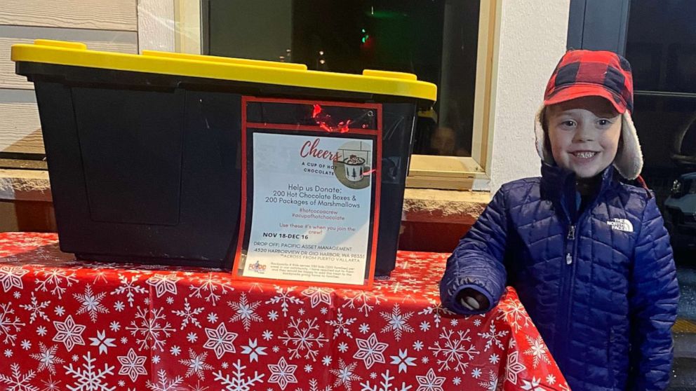 PHOTO: Hudson Galligan, 5, stands with a box for hot chocolate donations.