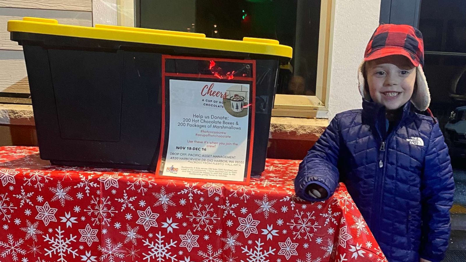 PHOTO: Hudson Galligan, 5, stands with a box for hot chocolate donations.