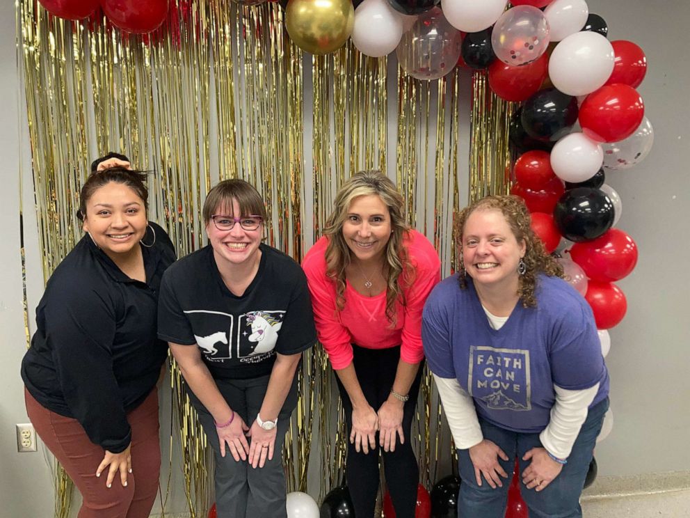 PHOTO: Larissa Garcia, Casey Parsons, Lisa James, and Erica Dexter at a celebration for their last day of class.