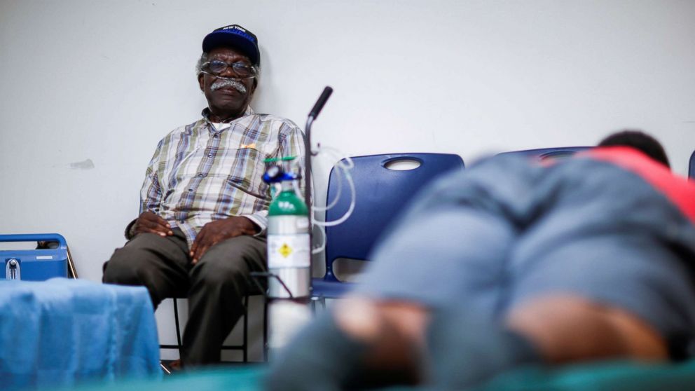 PHOTO: A man attached to a respiratory machine sits in a shelter run by Red Cross before Hurricane Florence comes ashore in Grantsboro, N.C., Sept. 13, 2018.