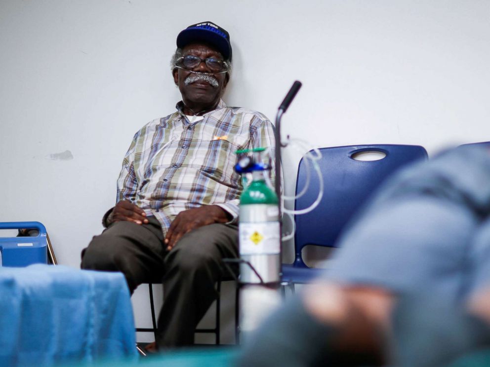 PHOTO: A man attached to a respiratory machine sits in a shelter run by Red Cross before Hurricane Florence comes ashore in Grantsboro, N.C., Sept. 13, 2018.