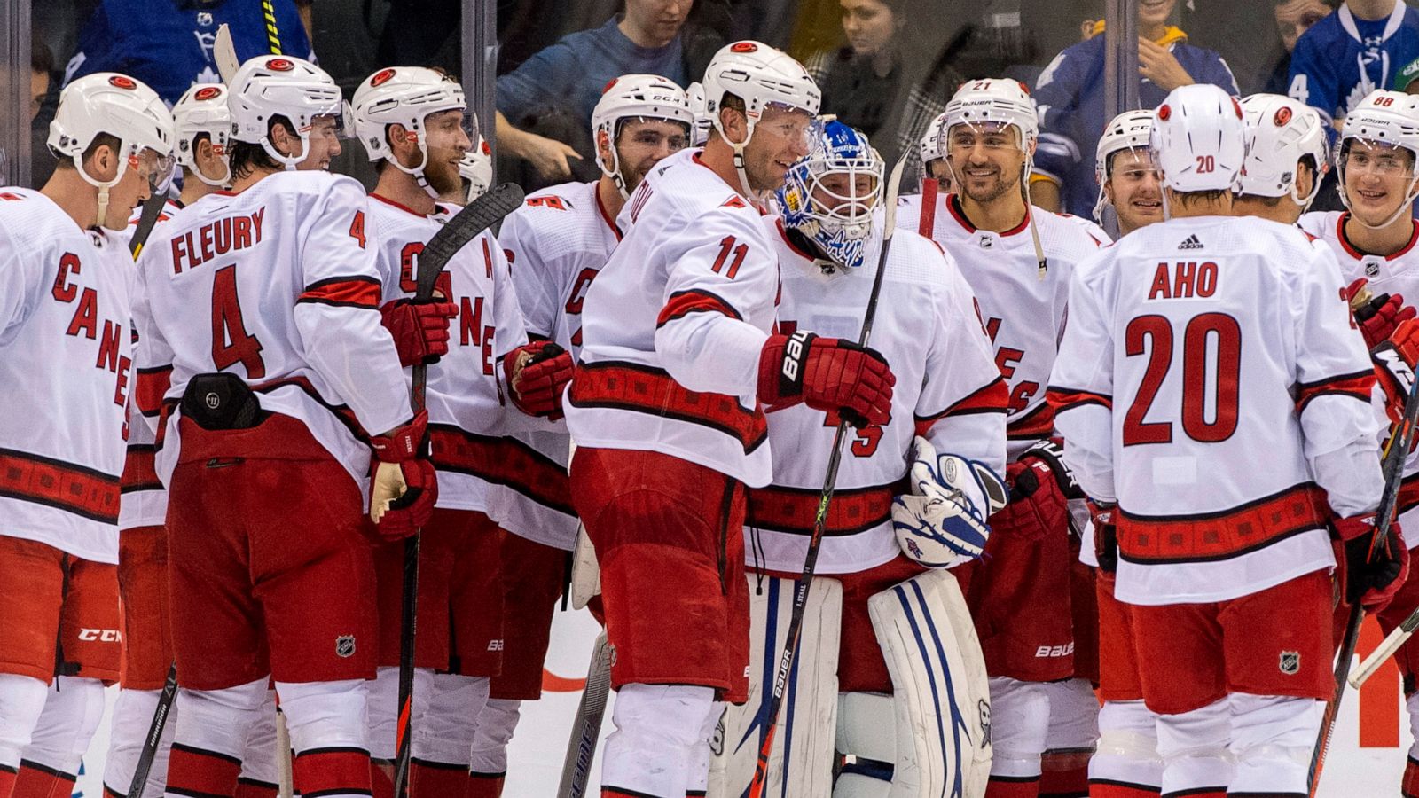 PHOTO: Members of the Carolina Hurricanes congratulate emergency goaltender David Ayres after they beat the Toronto Maple Leafs 6-3 in an NHL hockey game in Toronto, Feb. 22, 2020.