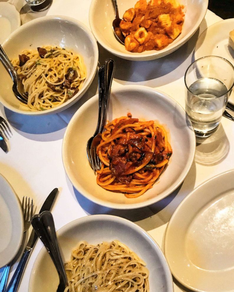 PHOTO: Bucatini all'Amatriciana seen plated in the middle of the table.