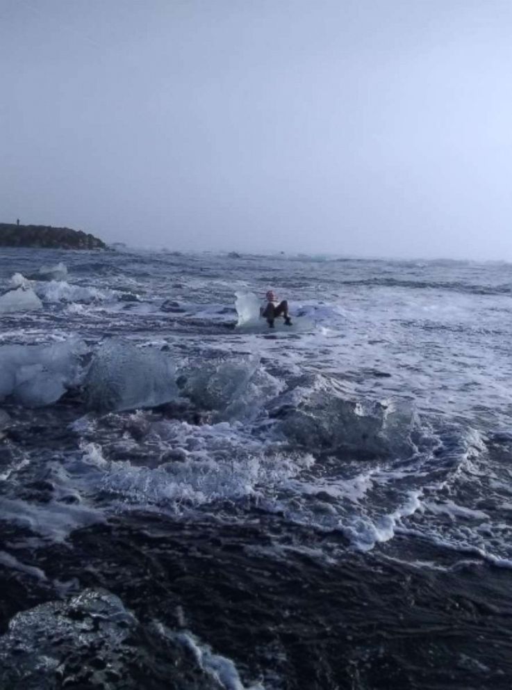 PHOTO: Judith Streng posed seated on an iceberg while her son Rod Streng took a picture before a wave pulled her out and prompted a rescue.