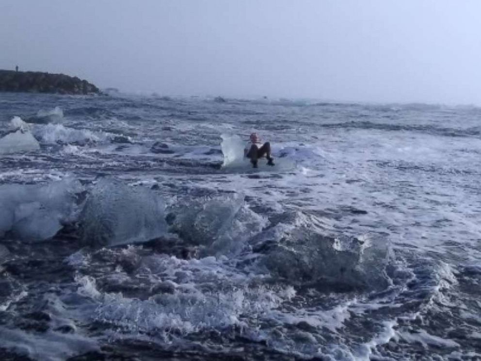 PHOTO: Judith Streng posed seated on an iceberg while her son Rod Streng took a picture before a wave pulled her out and prompted a rescue.