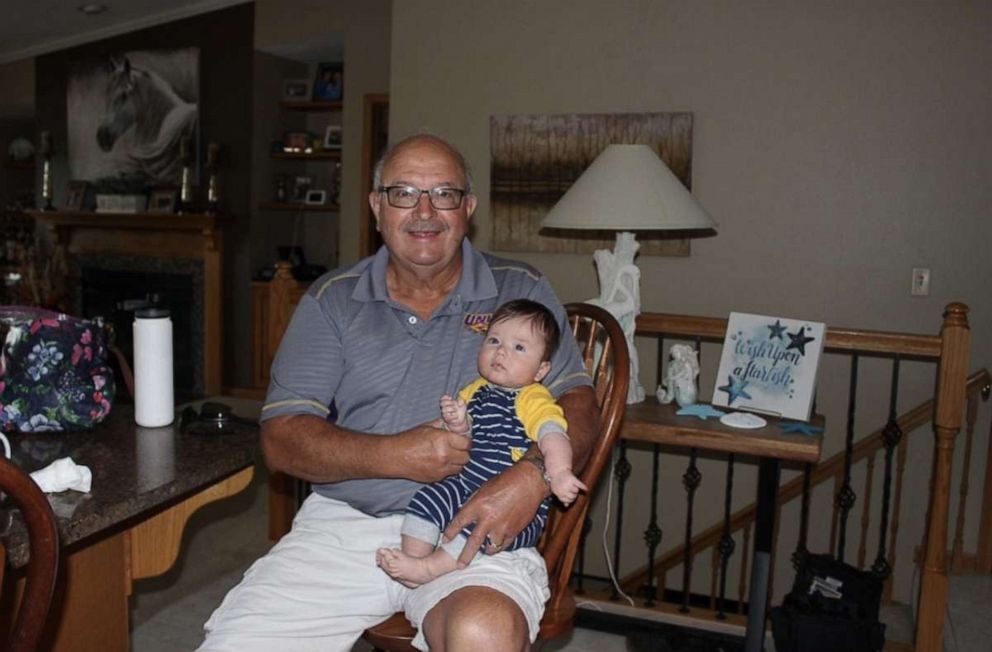 PHOTO: Bridget Otto is an intensive care unit nurse at University of Iowa Hospitals and Clinics' dedicated hospital for treating COVID-19 patients. Her dad Dwight Doughan tested positive on Sept. 19. Here he's pictured with his grandson Graham, 6 months.