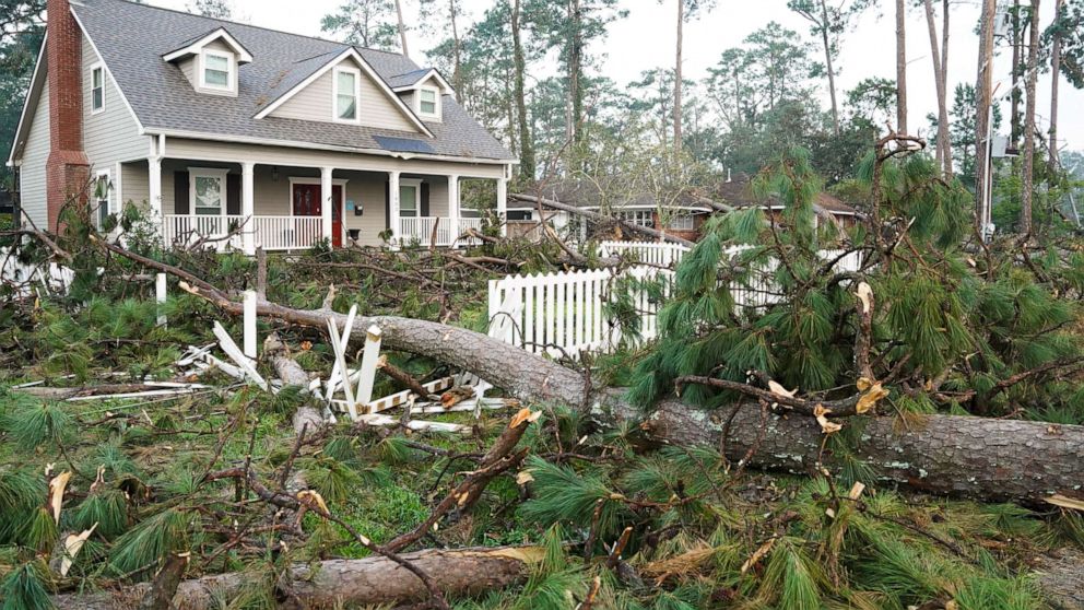 PHOTO: Fallen trees and broken limbs surround a home after Hurricane Ida, Sept. 2, 2021, in Hammond, Louisiana. 