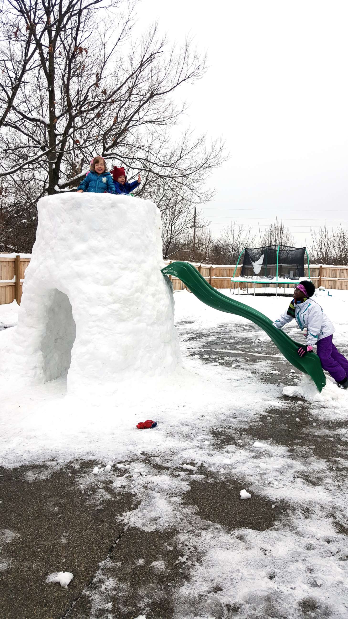 PHOTO: Gregg Eichhorn added a slide to the snow fort he built in the family's backyard.