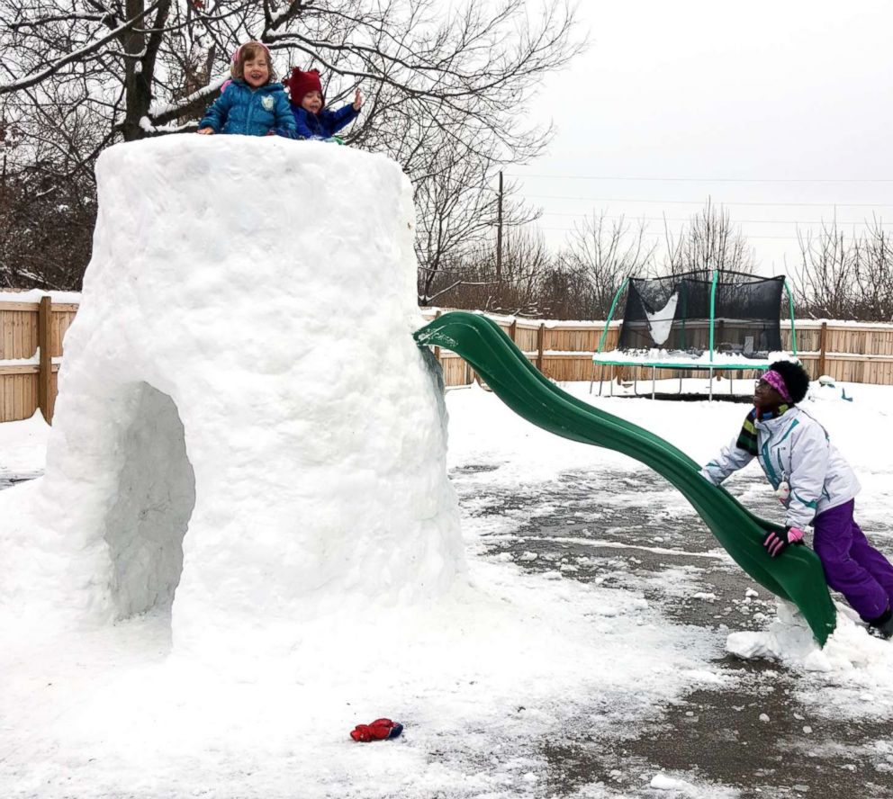 PHOTO: Gregg Eichhorn added a slide to the snow fort he built in the family's backyard.