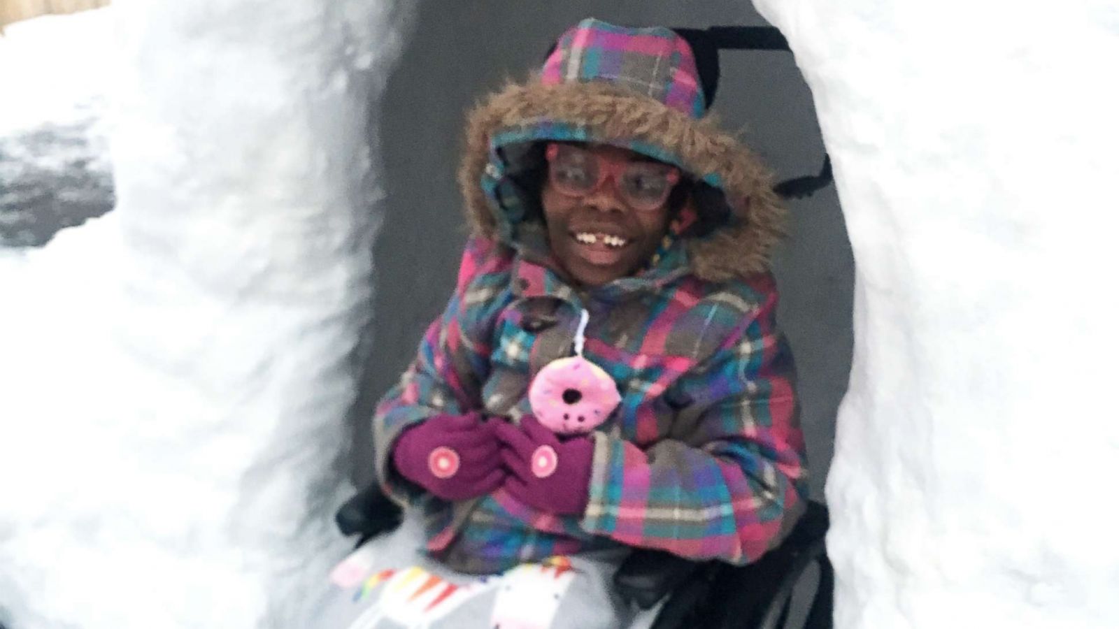 PHOTO: Zahara Eichhorn, of Ohio, poses in a snow fort built in her family's backyard.