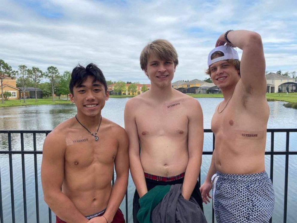 PHOTO: The Brostowitz brothers pose with their new tattoos.