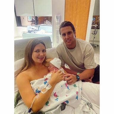 PHOTO: Maisie Savage and Josh French with their son Theo.