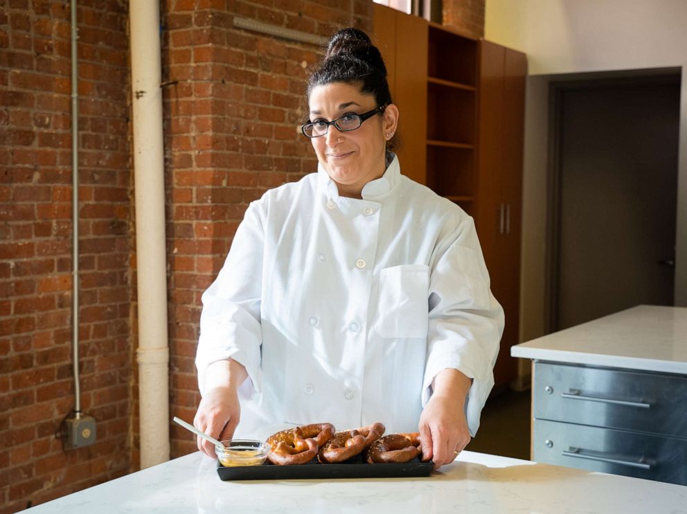 PHOTO: Inci Mayo with a plate of homemade soft pretzels in the Hot Bread Kitchen headquarters.