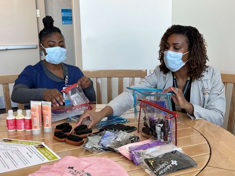 PHOTO: Dr. Jacobs and other staffers at Advocate Children's Hospital team up to put the inclusive hair kits together.