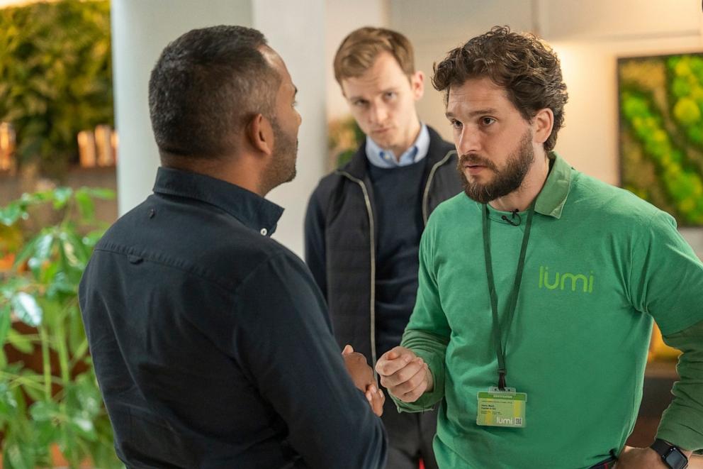 PHOTO: Amol Rajan, left, Harry Lawtey, center, and Kit Harington are seen in a still from season three of HBO's "Industry."