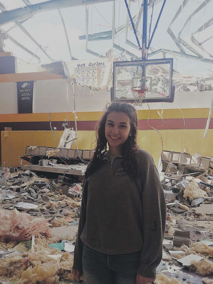 PHOTO: Senior class president, Allison Sigler, poses in front of, what once was, the senior hallway after the tornado in Chattanooga, Tenn.