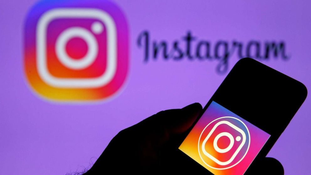 PHOTO: In this photo illustration, the Instagram logo is displayed on the screen of an iPhone in front of a TV screen displaying the Instagram logo on Dec. 10, 2019 in Paris.