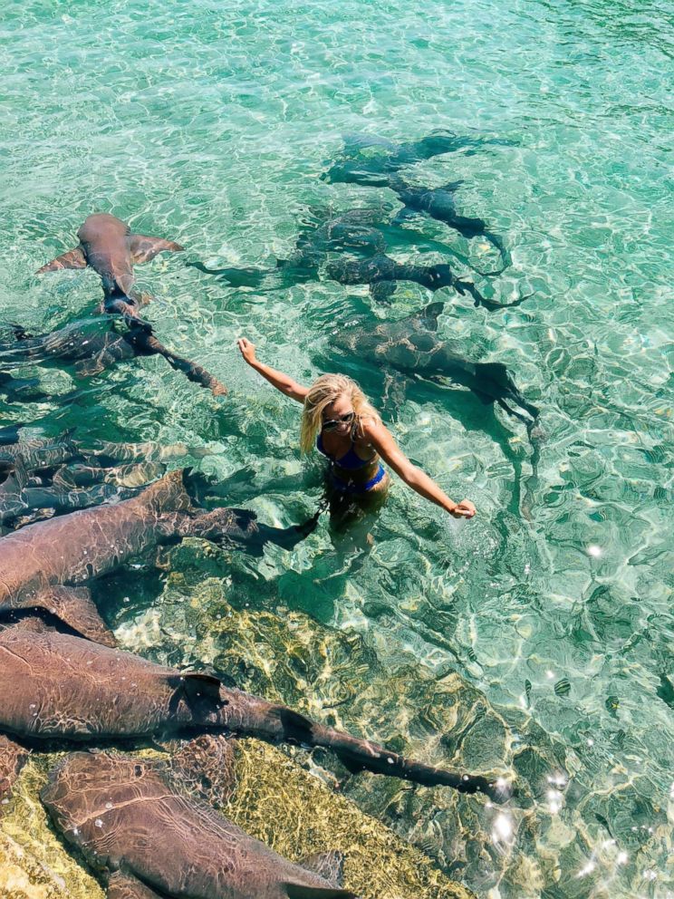 PHOTO: Instagram model Katarina Zarutskie stands alongside nurse sharks in the Bahamas.