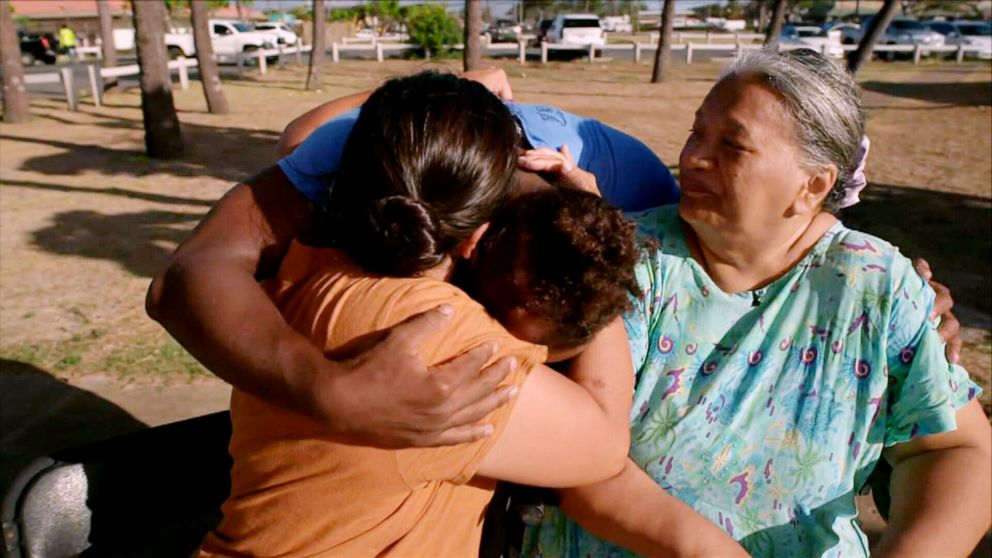 PHOTO: Lani Williams and her mother, Sincerity Mirkovich, hug Benny Reinicke, who saved them from the Maui wildfires.