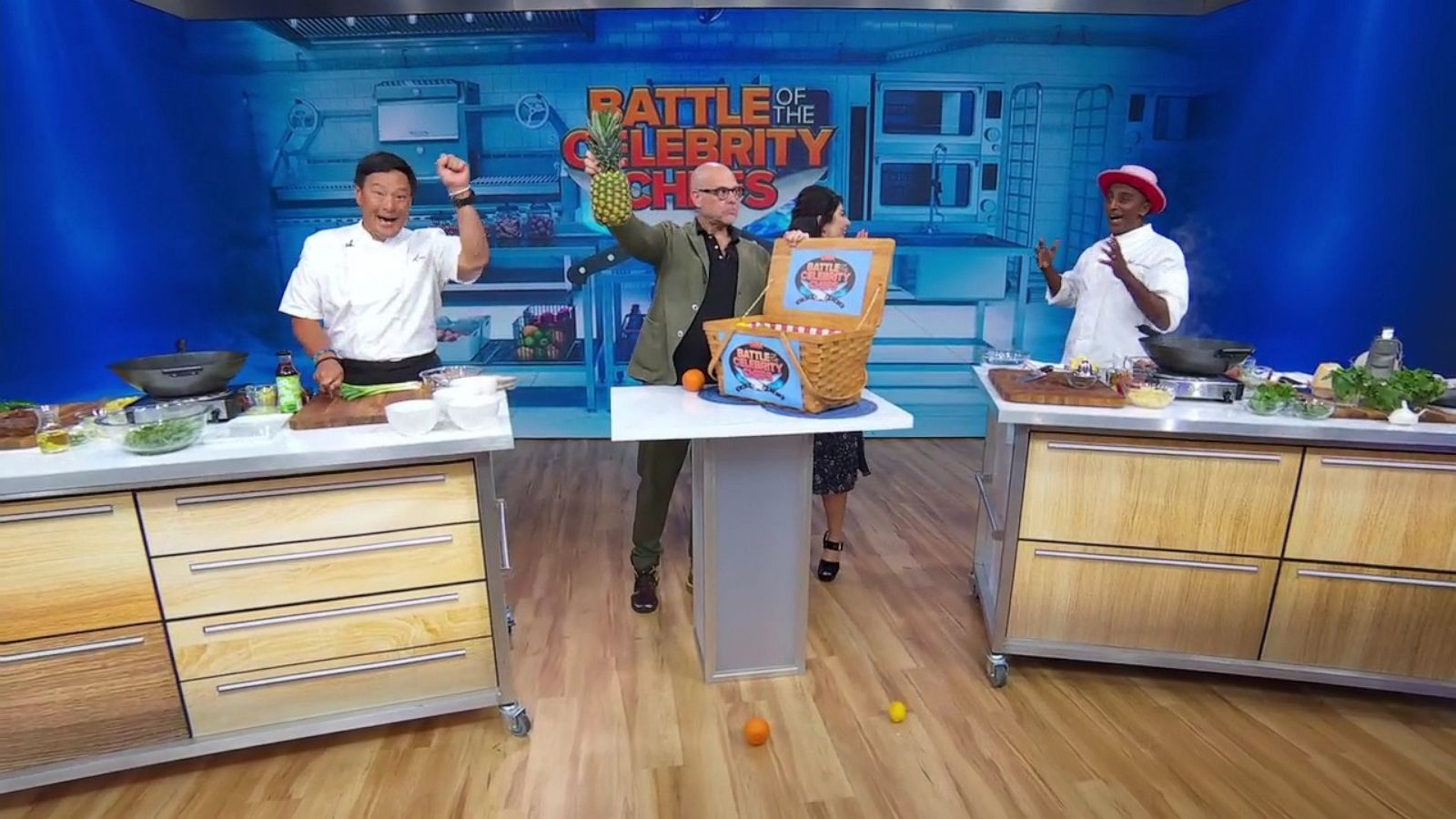 PHOTO: Chefs Ming Tsai and Marcus Samuelsson of "Iron Chef: Quest for an Iron Legend" battle pineapple with Alton Brown on "GMA."