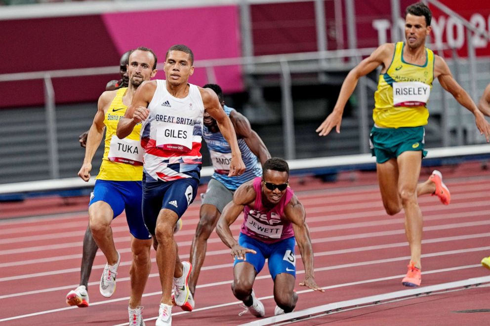 PHOTO: Isaiah Jewett, of United the States, and Nijel Amos, of Botswana, fall in the men's 800-meter semifinal at the 2020 Summer Olympics, Aug. 1, 2021, in Tokyo.