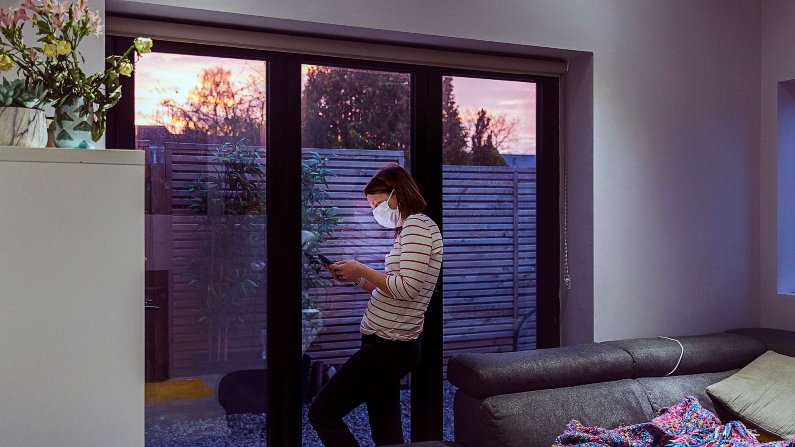 PHOTO: A woman looks at her phone in this stock photo.