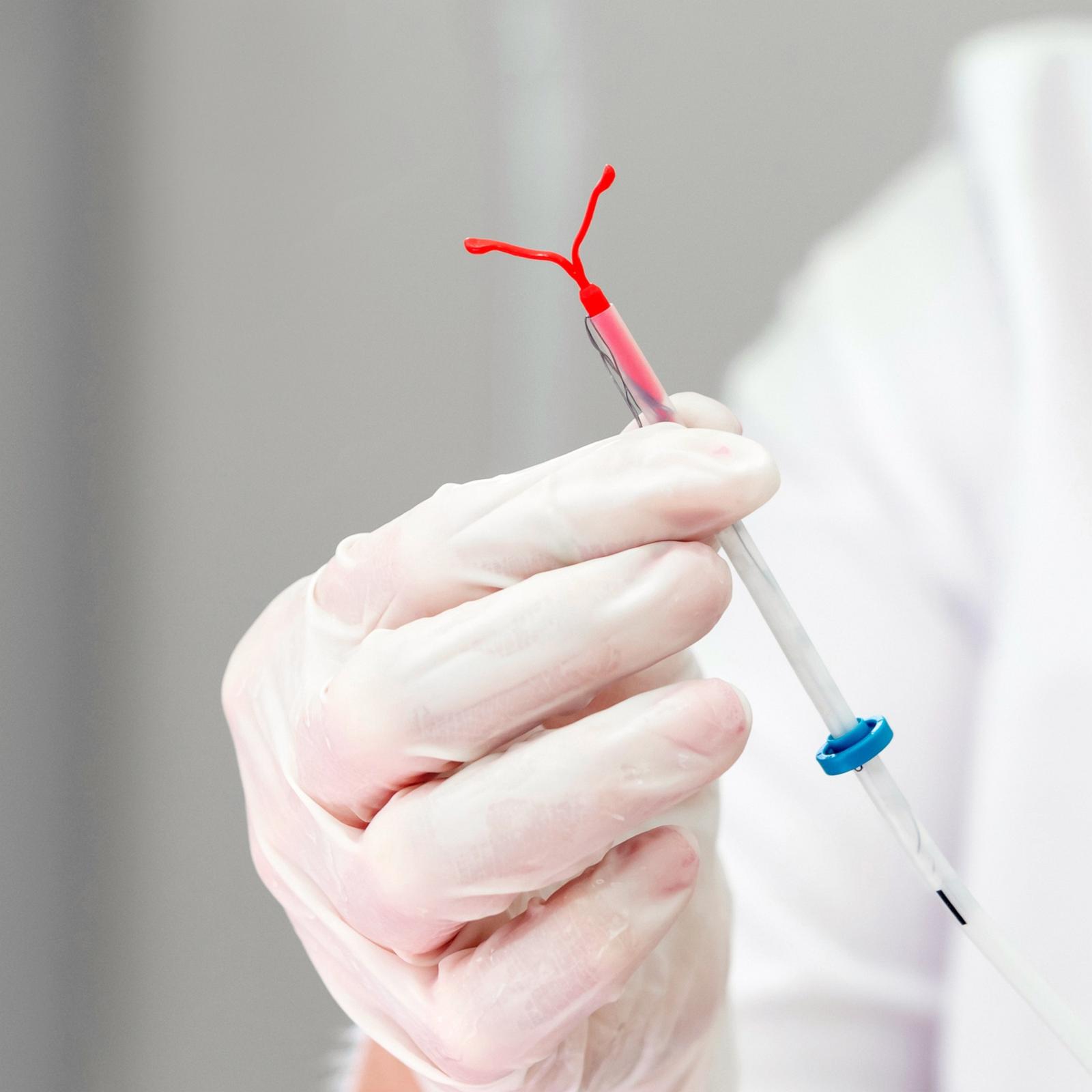PHOTO: Stock photo of a doctor holding an IUD device.