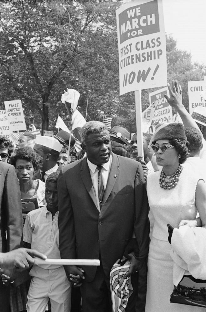 PHOTO: Baseball player Jackie Robinson (c), son David Robinson, and wife Rachel Robinson participate in the March on Washington for Jobs and Freedom political rally in Washington, Aug. 28, 1963.