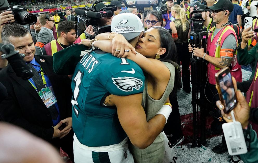 PHOTO: Philadelphia Eagles' quarterback Jalen Hurts hugs his fiance, Bry Burrows, after the Eagles defeated the Kansas City Chiefs 40-22 in Super Bowl LIX in New Orleans, La., Feb. 9, 2025. 