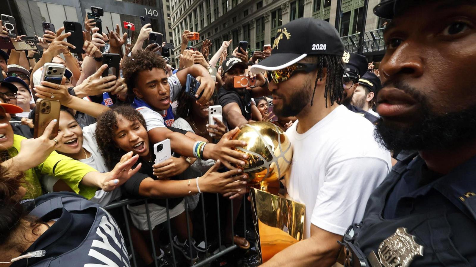 PHOTO: Jalen Brunson celebrates with the Larry O'Brien Championship Trophy during the New York Knicks Parade on June 18, 2026, in New York.