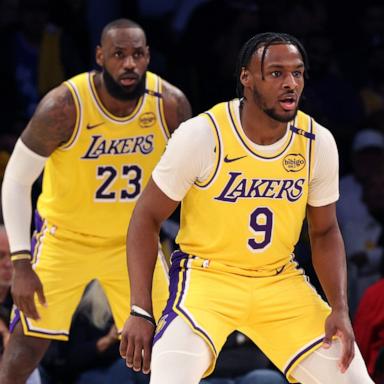 PHOTO: LeBron James #23 and Bronny James #9 of the Los Angeles Lakers on defense during the second quarter against the Minnesota Timberwolves at Crypto.com Arena on Oct. 22, 2024 in Los Angeles.