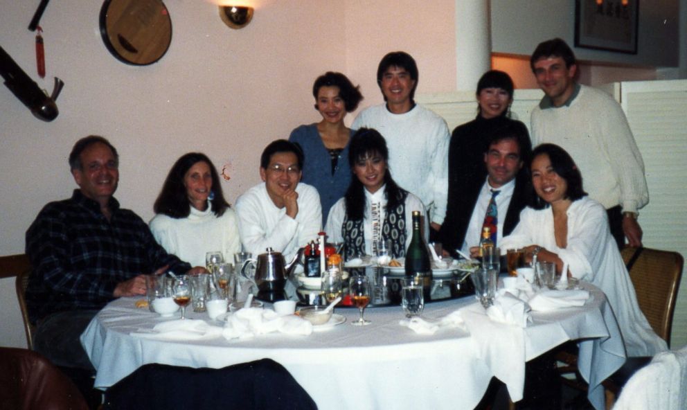 PHOTO: Janet Yang, seated on the far right, is pictured at a celebratory dinner in San Francisco with Oliver Stone, Amy Tan and Joan Chen among others.