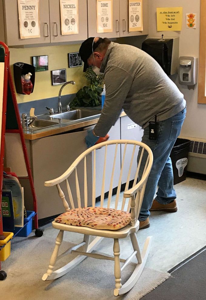 PHOTO: Custodian John Baggs cleans at Allen Brook school in Williston, Vermont, amid the novel coronavirus outbreak.