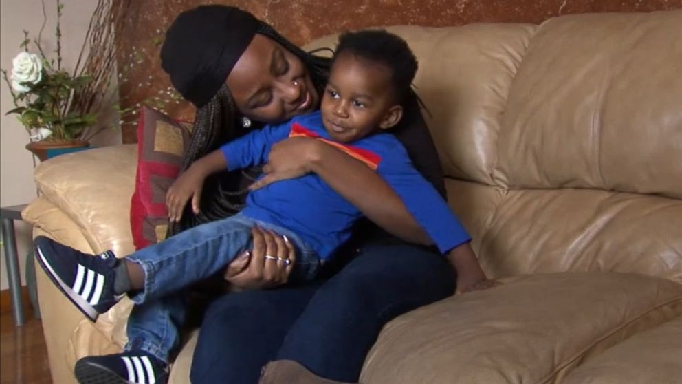 PHOTO: Jasmin Ford, 30, holds her son, Caleb, after receiving a surprise student loan payment from Fifth Third Bank.