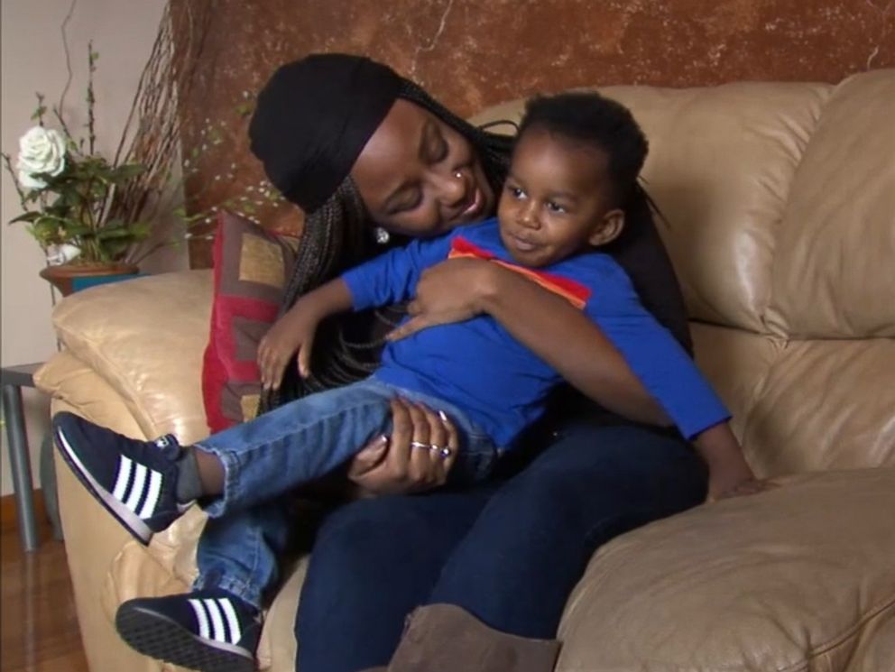 PHOTO: Jasmin Ford, 30, holds her son, Caleb, after receiving a surprise student loan payment from Fifth Third Bank.