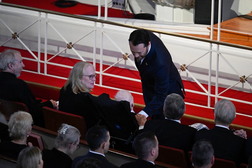 PHOTO: Jason Carter speaks to his grandfather, former U.S. president Jimmy Carter, as daughter Amy Carter (L) looks on during a tribute service for former first lady Rosalynn Carter at Glenn Memorial Church, Nov. 28, 2023, in Atlanta. 