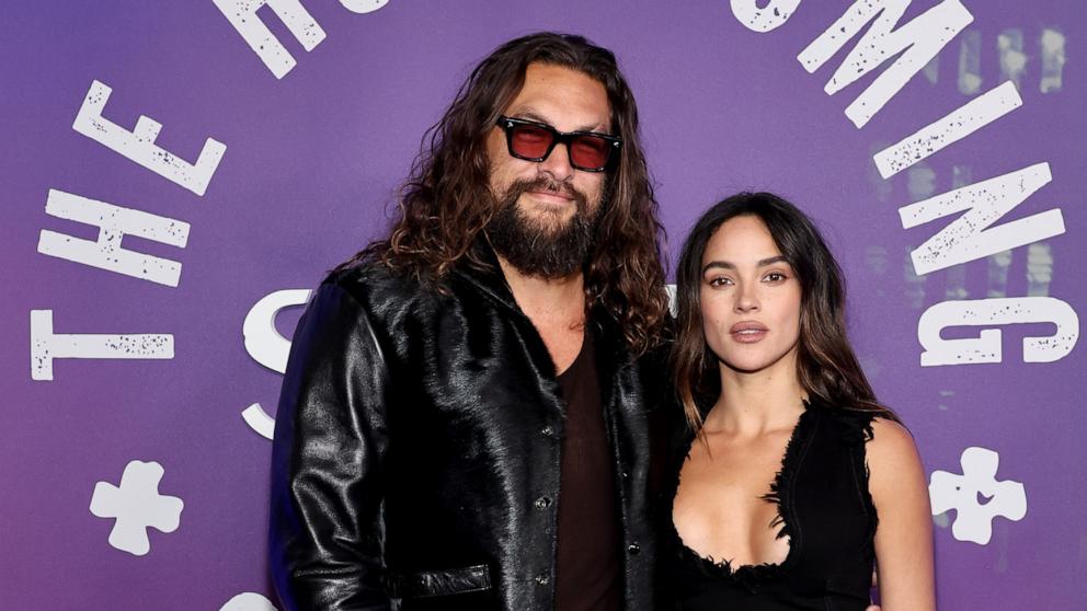 PHOTO: Jason Momoa and Adria Arjona pose at Radio City Music Hall on Feb. 14, 2025 