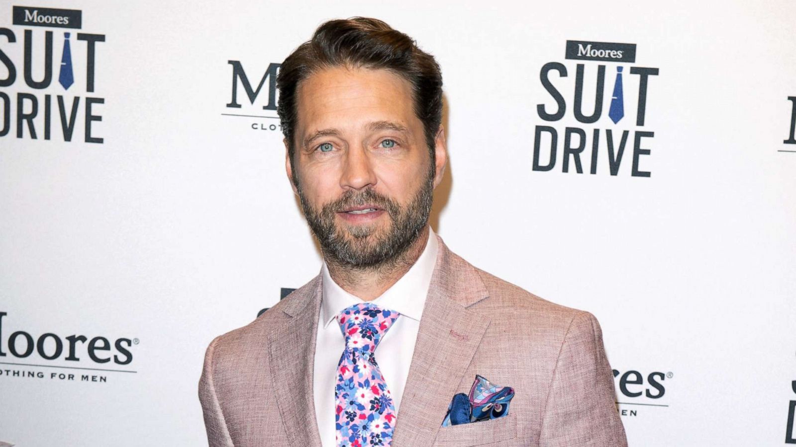 PHOTO: Jason Priestley donates a suit to the 10th Annual Moores Suit Drive at the Moores flagship clothing store, July 9, 2019, in Toronto, Canada.