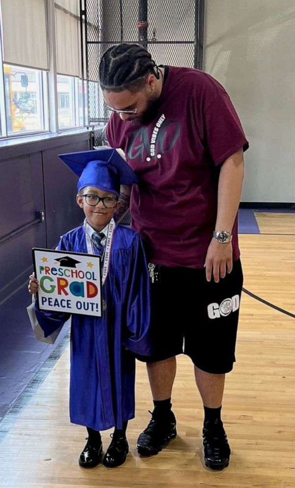 PHOTO: Jaxon Carter, 6, poses with his father at his kindergarten graduation ceremony in June 2023.