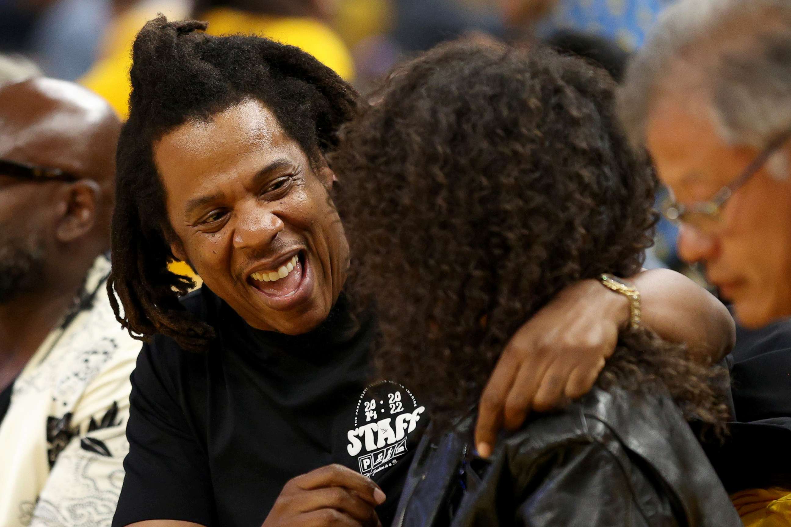 PHOTO: Rapper Jay-Z hugs his daughter Blue Ivy Carter during the second quarter of Game Five of the 2022 NBA Finals between the Boston Celtics and the Golden State Warriors at Chase Center, June 13, 2022 in San Francisco.