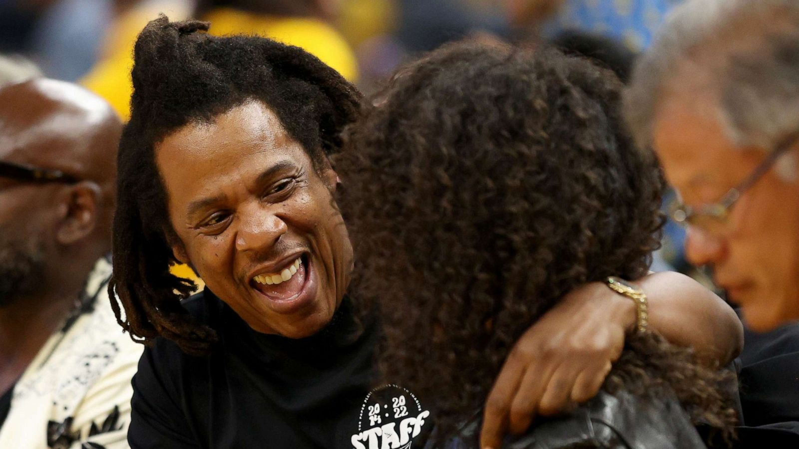 PHOTO: Rapper Jay-Z hugs his daughter Blue Ivy Carter during the second quarter of Game Five of the 2022 NBA Finals between the Boston Celtics and the Golden State Warriors at Chase Center, June 13, 2022 in San Francisco.