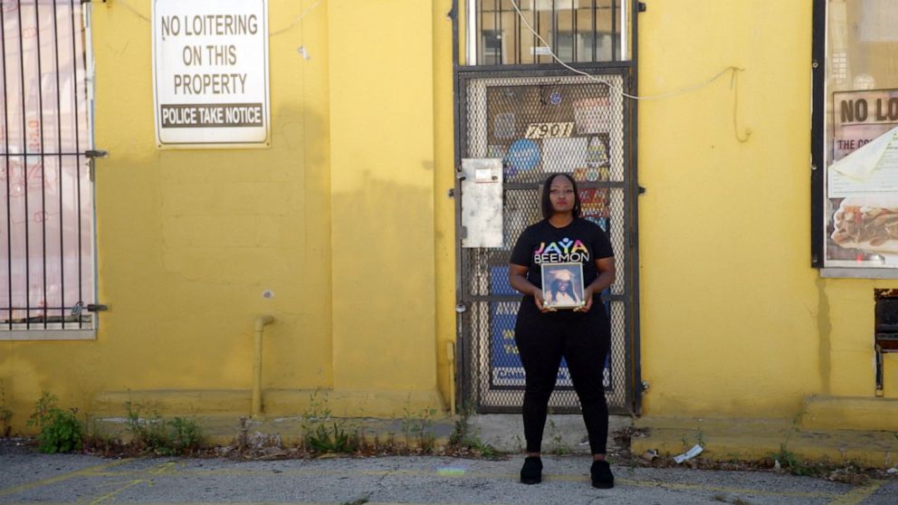 PHOTO: Nyisha Beemon, 36, stands in front of the Chicago convenience store where her daughter, Jaya, lost her life due to gun violence in 2020.